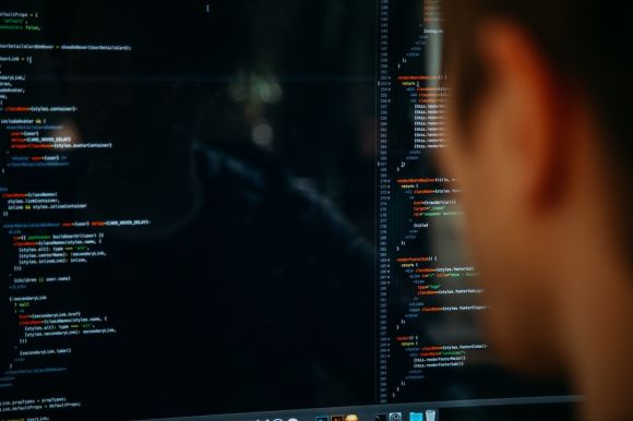 Development - person facing computer desktop