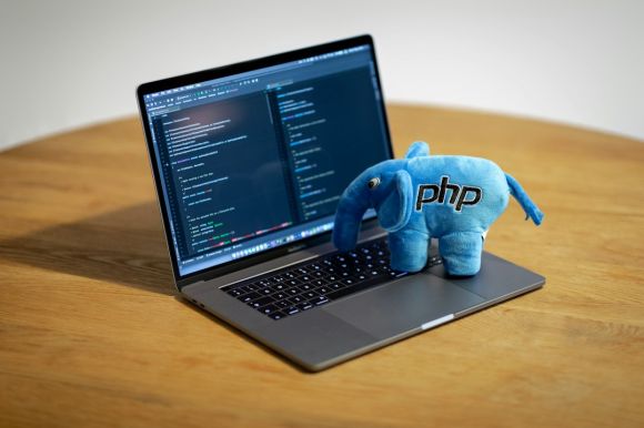 Php - blue elephant figurine on macbook pro