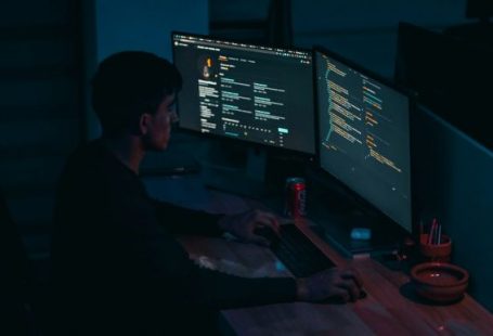 Developers - man in black long sleeve shirt using computer
