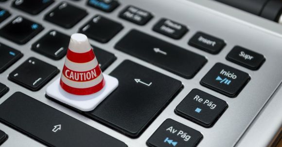 Data Security - White Caution Cone on Keyboard