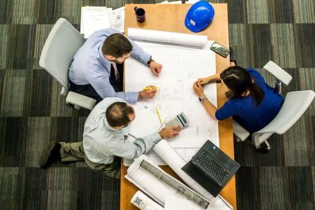 Project Management Tools - Three People Sitting Beside Table